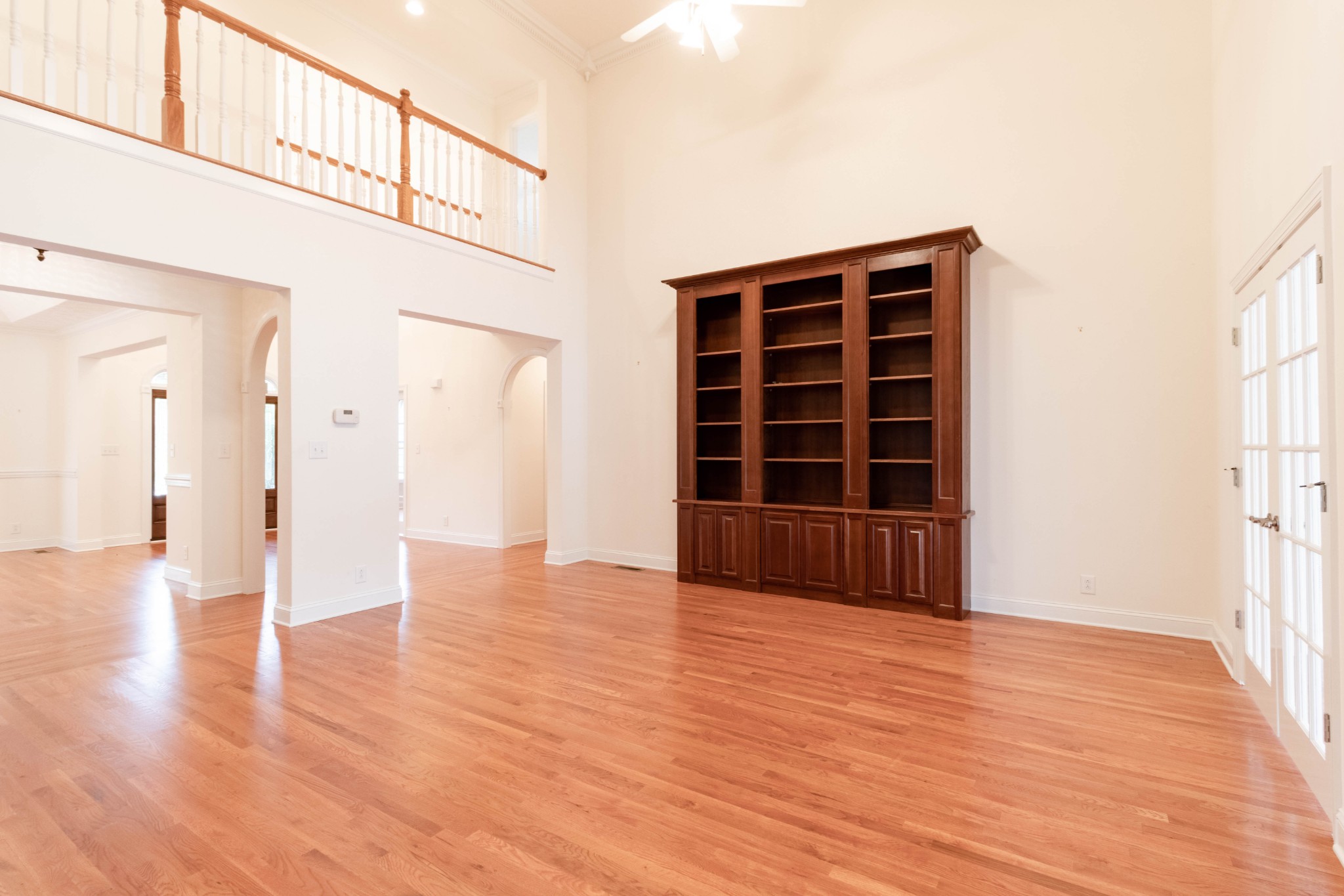 563 Pond Apple Road Clarksville, TN 37043 - Photo 8 of 39 a view of an empty room with wooden floor and windows