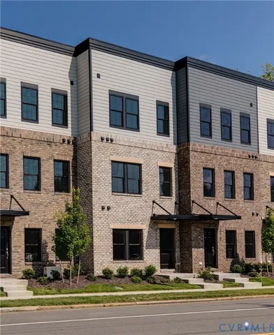 a view of a building with a yard