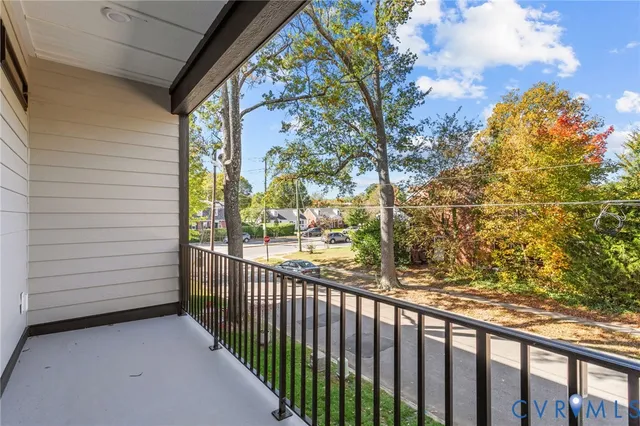 a view of a balcony with wooden fence