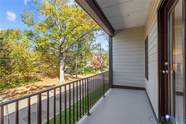 a view of a porch with wooden floor and fence