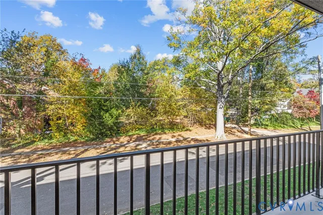 a view of a balcony with a tree