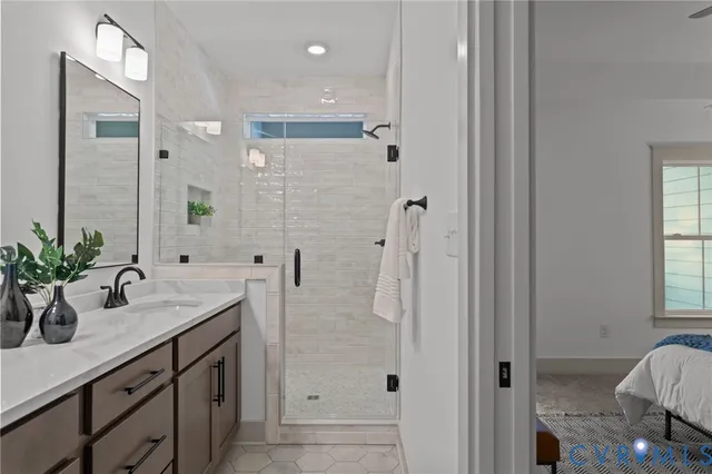 a bathroom with a shower sink and mirror