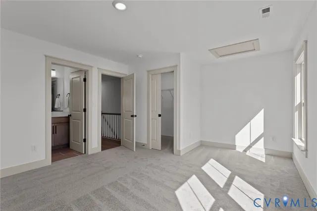 a bathroom with a sink a toilet a mirror a vanity and shower