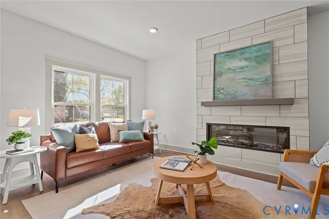 a living room with furniture and a fireplace