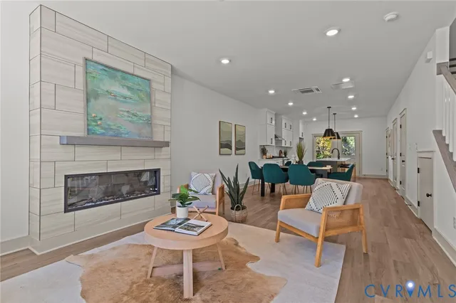 a living room with furniture and a fireplace