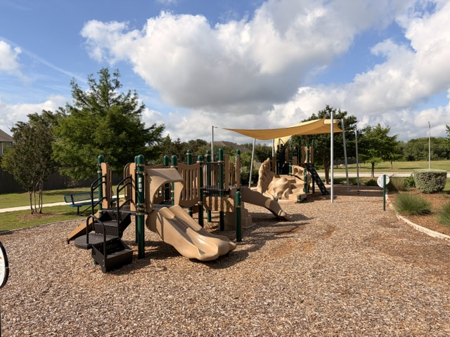 6917 Colorado Bluffs Road Austin, TX 78744 - Photo 17 of 19 a view of a park with slide