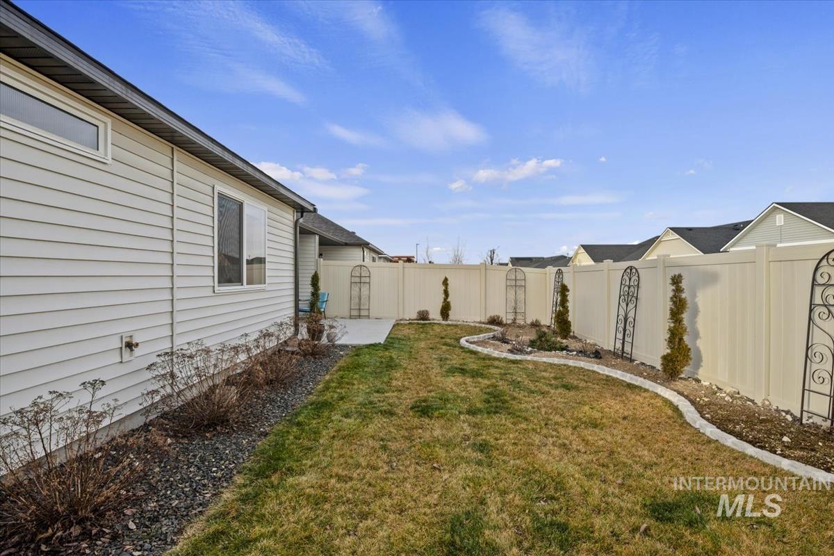 193 West Haniken Street Meridian, ID 83642 - Photo 22 of 27 Fenced backyard with a patio