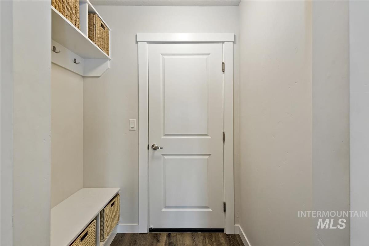 193 West Haniken Street Meridian, ID 83642 - Photo 5 of 27 Mudroom with dark wood finished floors and baseboards