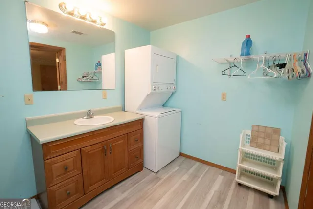 a bathroom with a sink a vanity and mirror