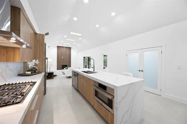 a bathroom with a double vanity sink and mirror