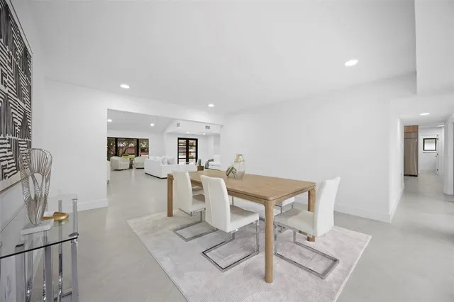 an aerial view of residential houses with outdoor space and street view