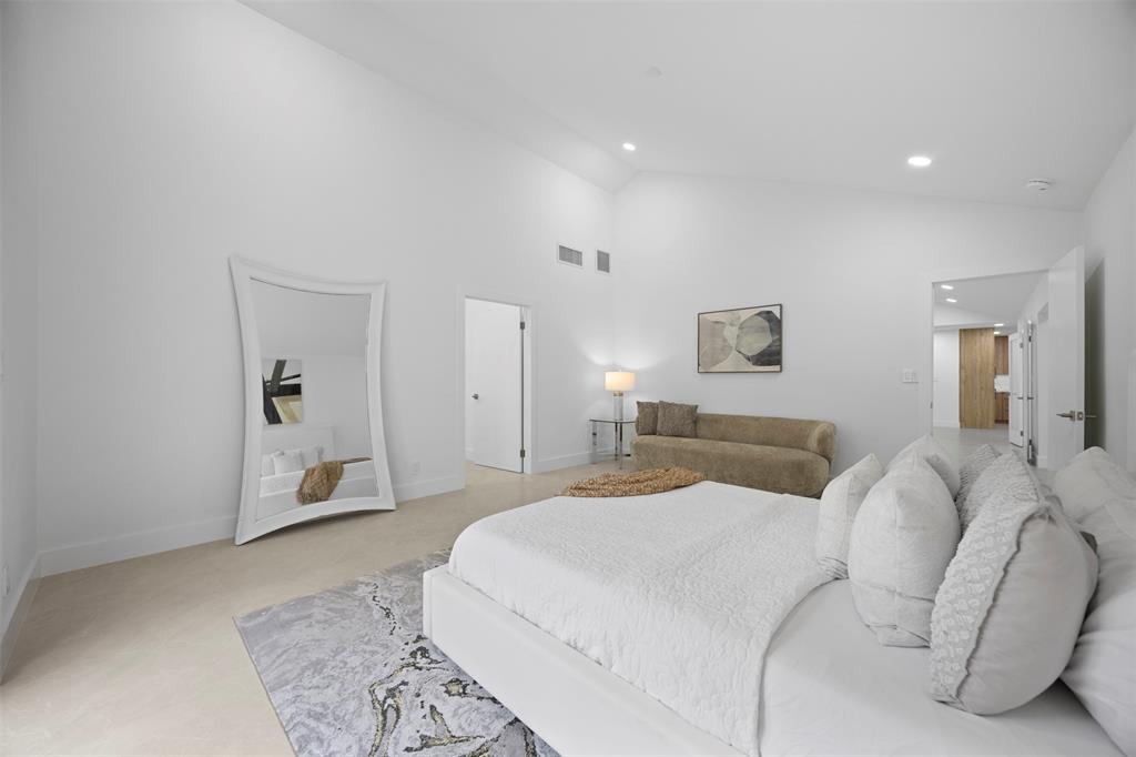 7571 Estrella Circle Boca Raton, FL 33433 - Photo 30 of 76 a spacious bedroom with a bed and a couch