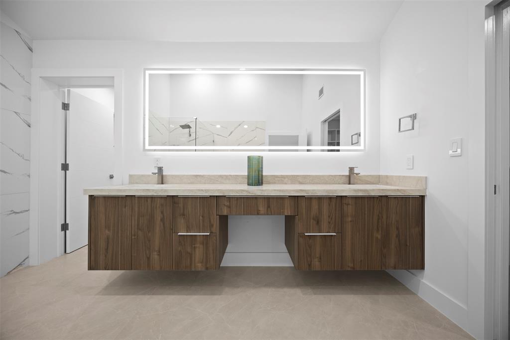 7571 Estrella Circle Boca Raton, FL 33433 - Photo 37 of 76 a bathroom with a sink double vanity and a mirror