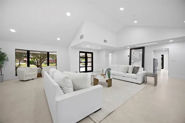 a bedroom with a bed and a mirror