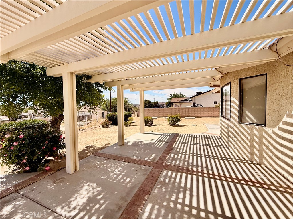 14890 Apple Valley Road Apple Valley, CA 92307 - Photo 21 of 28 a view of a porch