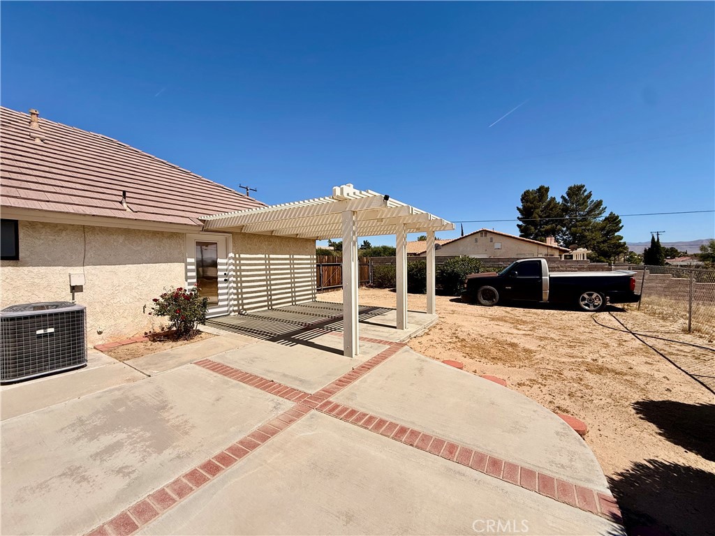 14890 Apple Valley Road Apple Valley, CA 92307 - Photo 22 of 28 a view of a house with a patio