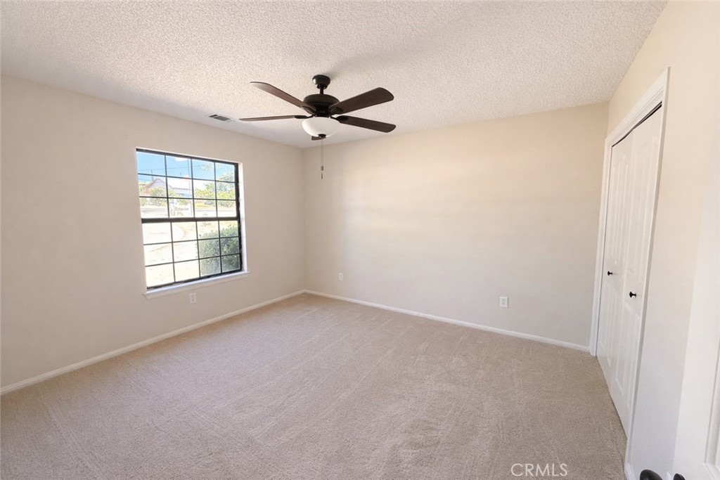 14890 Apple Valley Road Apple Valley, CA 92307 - Photo 9 of 28 a view of an empty room with a window
