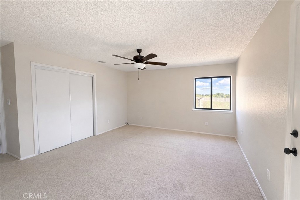 14890 Apple Valley Road Apple Valley, CA 92307 - Photo 10 of 28 a view of an empty room with a window