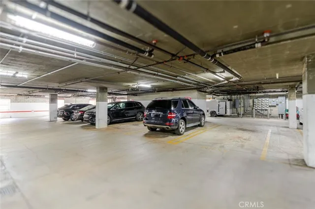 a view of parking garage with cars