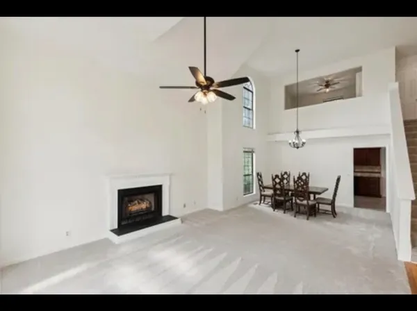 a view of a livingroom with furniture and a fireplace