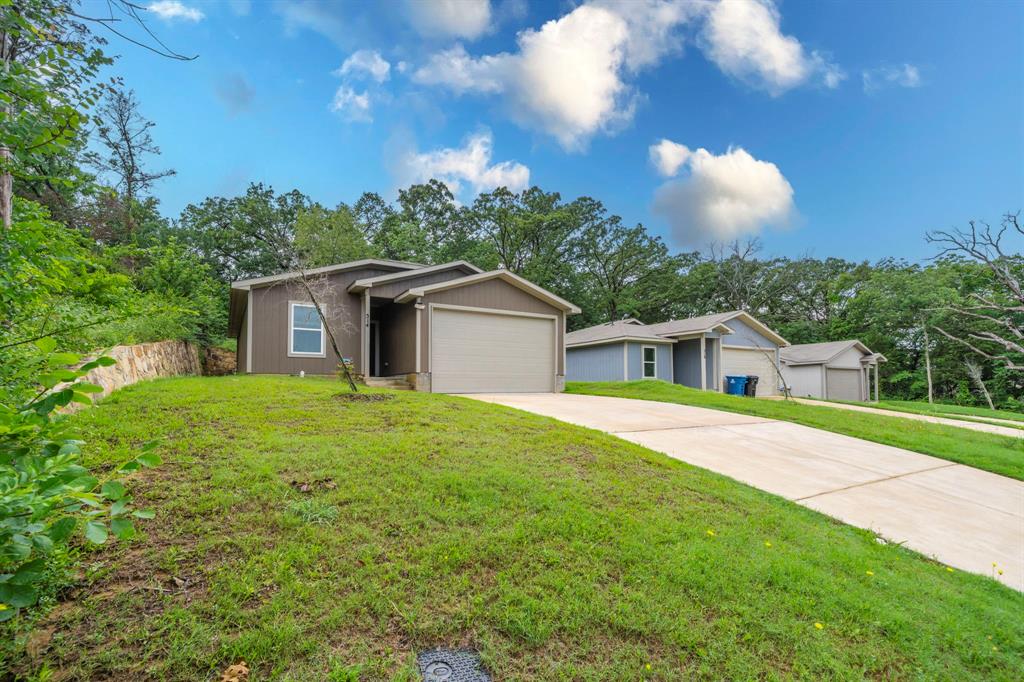 514 East Shepherd Street Denison, TX 75021 - Photo 2 of 16 a front view of a house with yard and green space