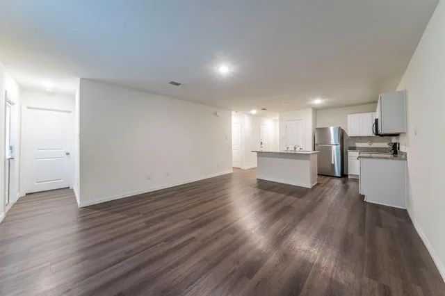 a view of kitchen with wooden floor