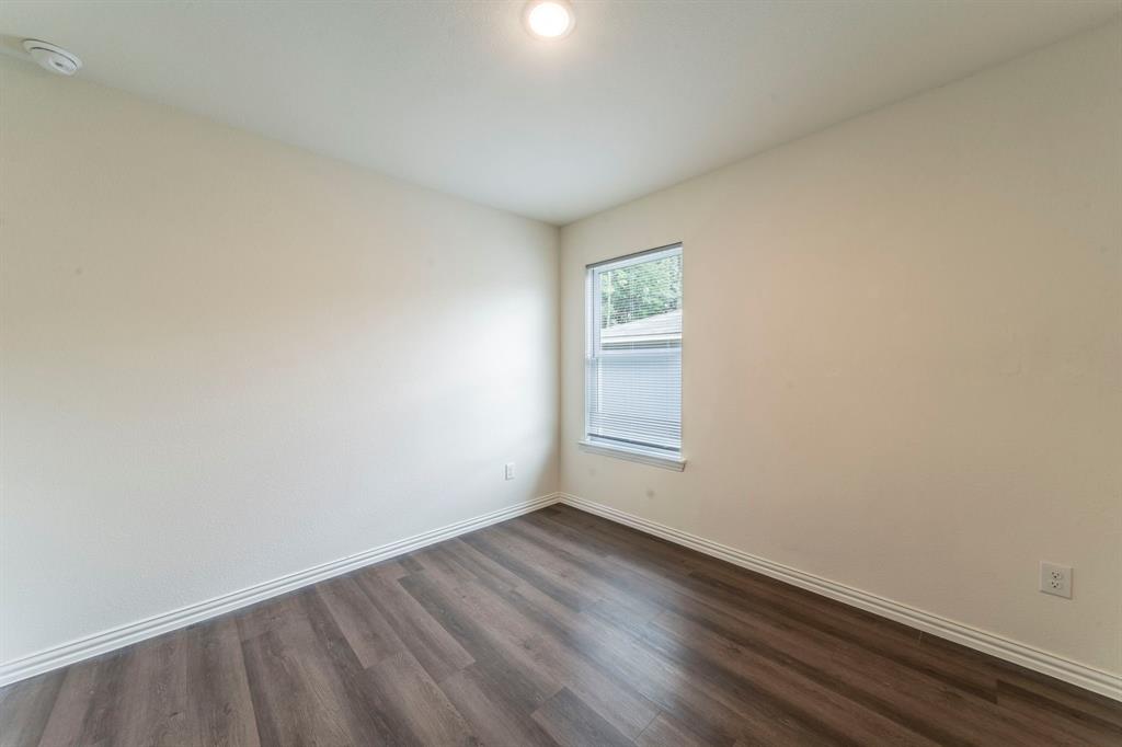 514 East Shepherd Street Denison, TX 75021 - Photo 10 of 16 an empty room with a window