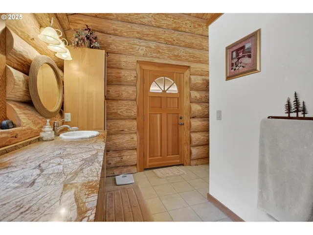 a view of a livingroom with furniture and staircase