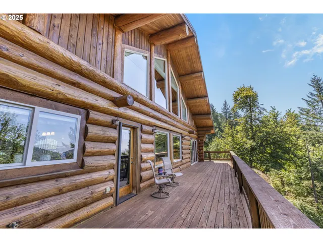 a bedroom with a bed with wooden floor