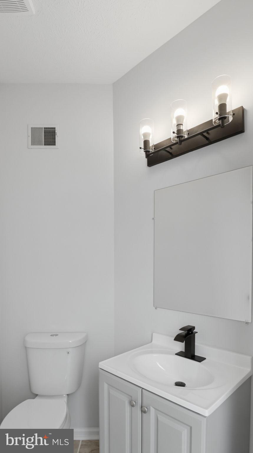 1404 Pangbourne Way Hanover, MD 21076 - Photo 11 of 31 a bathroom with a sink and a toilet