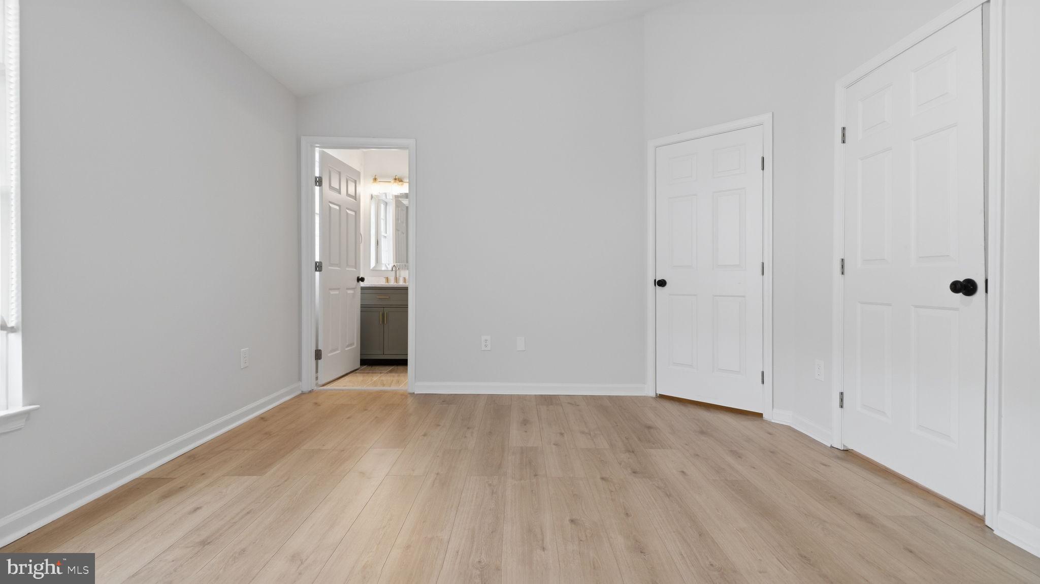 1404 Pangbourne Way Hanover, MD 21076 - Photo 13 of 31 a view of wooden floor and windows in a room