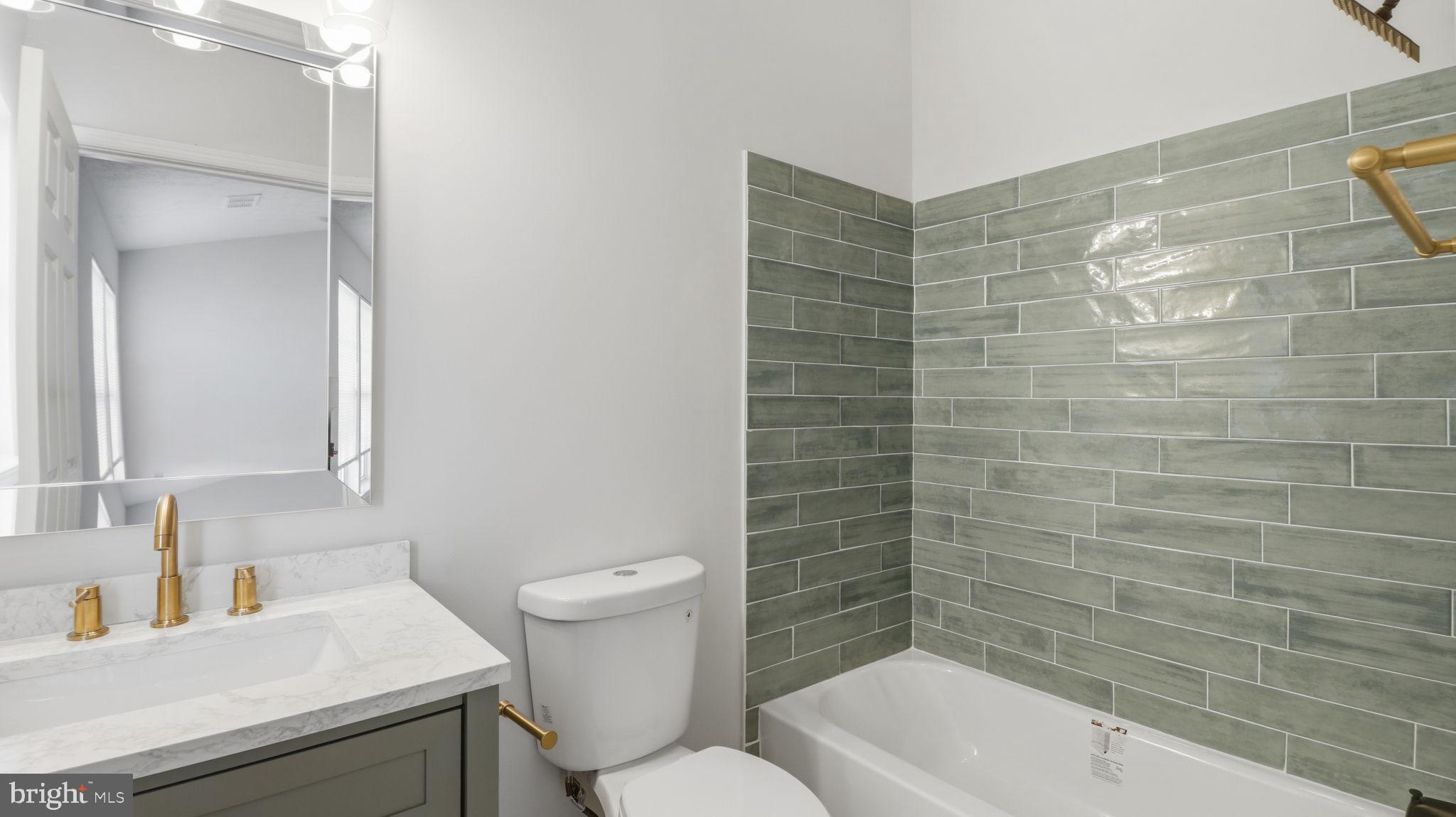 1404 Pangbourne Way Hanover, MD 21076 - Photo 16 of 31 a bathroom with a sink a toilet and shower
