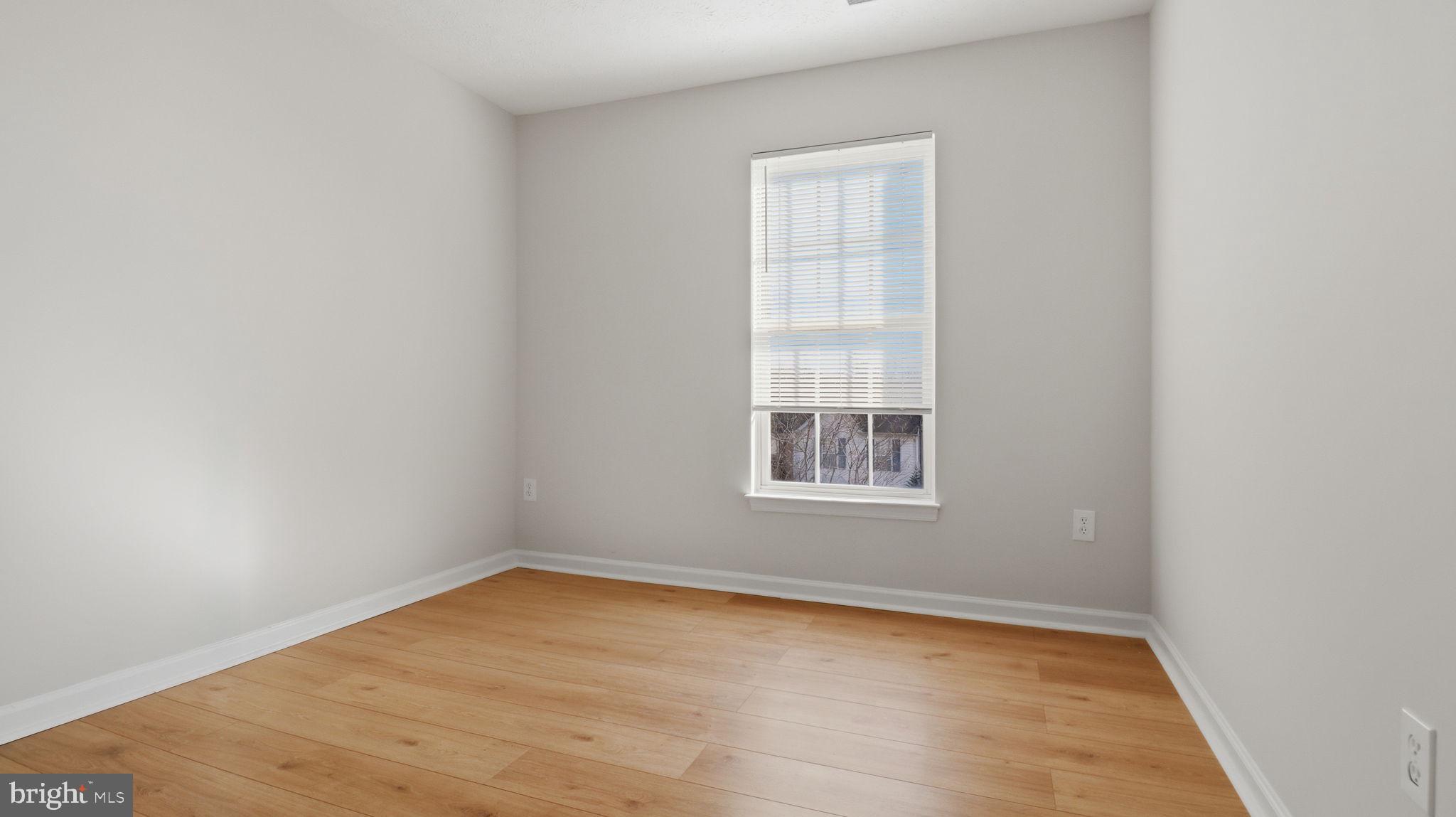 1404 Pangbourne Way Hanover, MD 21076 - Photo 19 of 31 an empty room with a window