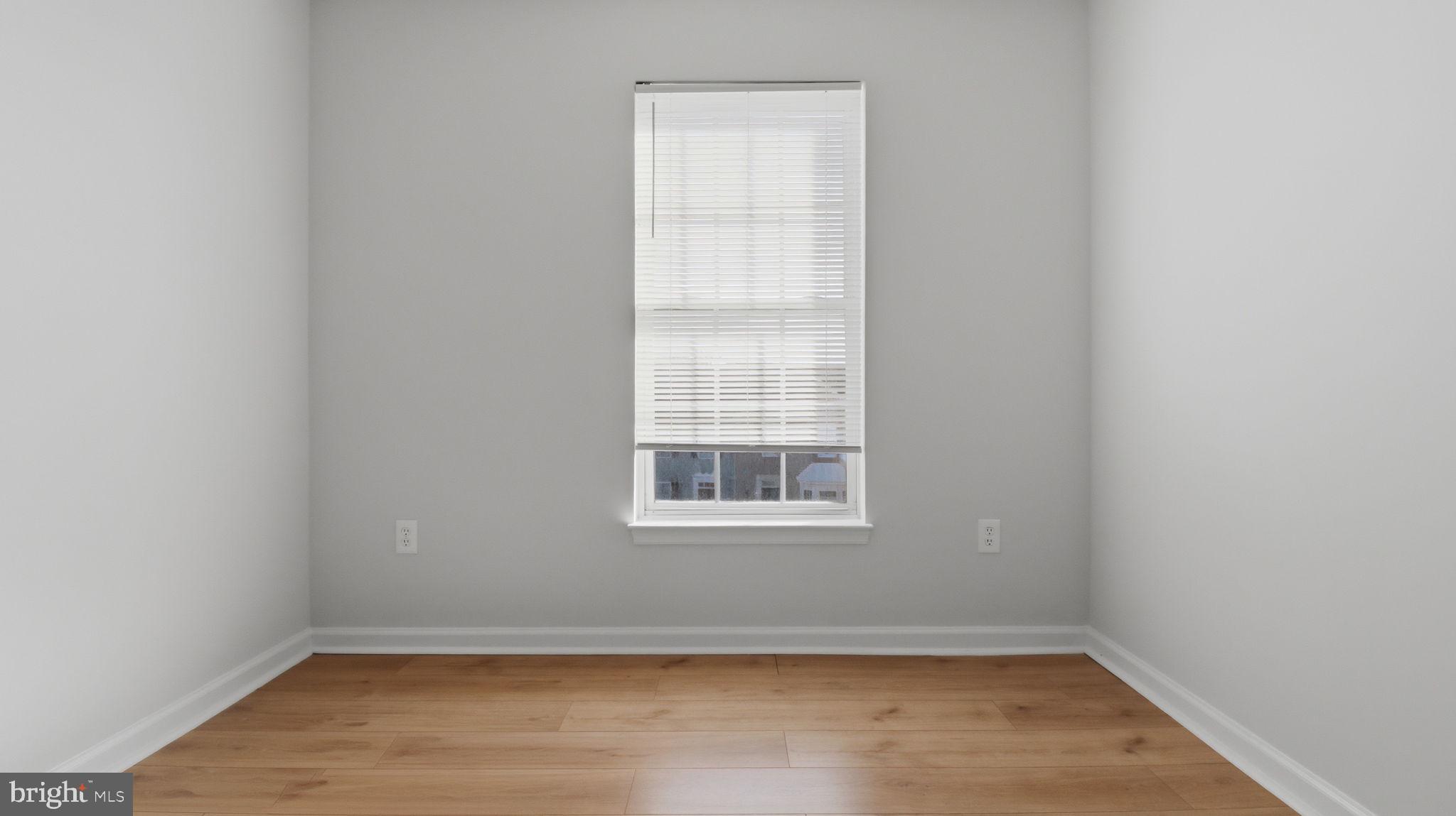 1404 Pangbourne Way Hanover, MD 21076 - Photo 23 of 31 a view of a small space with wooden floor and a window