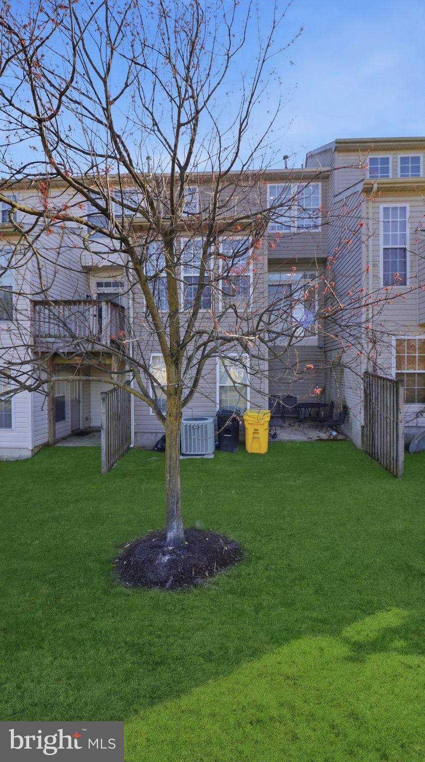 1404 Pangbourne Way Hanover, MD 21076 - Photo 28 of 31 a view of a house with a yard