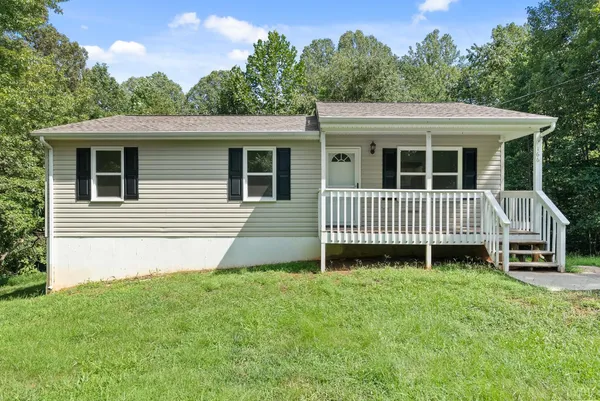 a view of a house with a sink and a yard