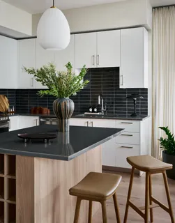 a kitchen with a table and chairs in it