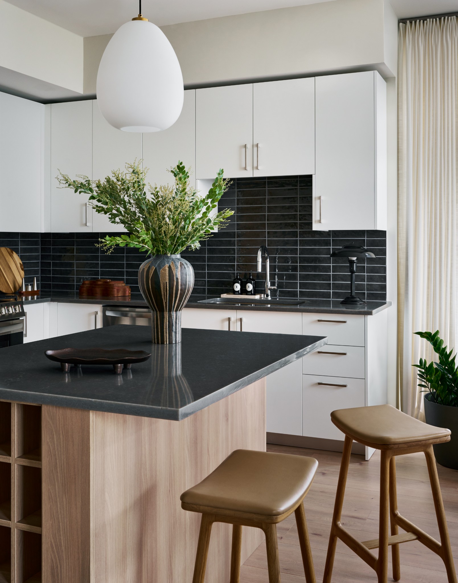 1212 Demonbreun Street, Unit B1 (B) Nashville, TN 37203 - Photo 2 of 26 a kitchen with a table and chairs in it