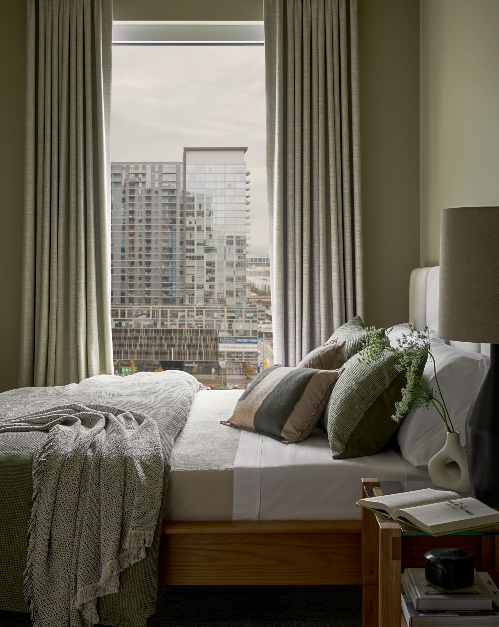 1212 Demonbreun Street, Unit B1 (B) Nashville, TN 37203 - Photo 6 of 26 a bedroom with a bed and a window