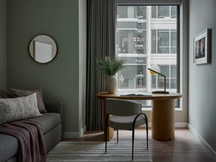 a living room with a table and chair