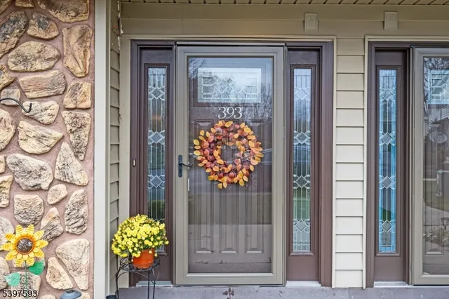 a front view of a house with a glass door and glass door