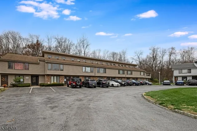a large building with trees in the background