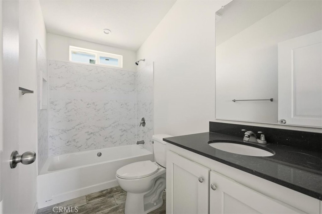 9622 Via Verde Avenue Pinon Hills, CA 92372 - Photo 20 of 48 a bathroom with a sink a toilet and bathtub