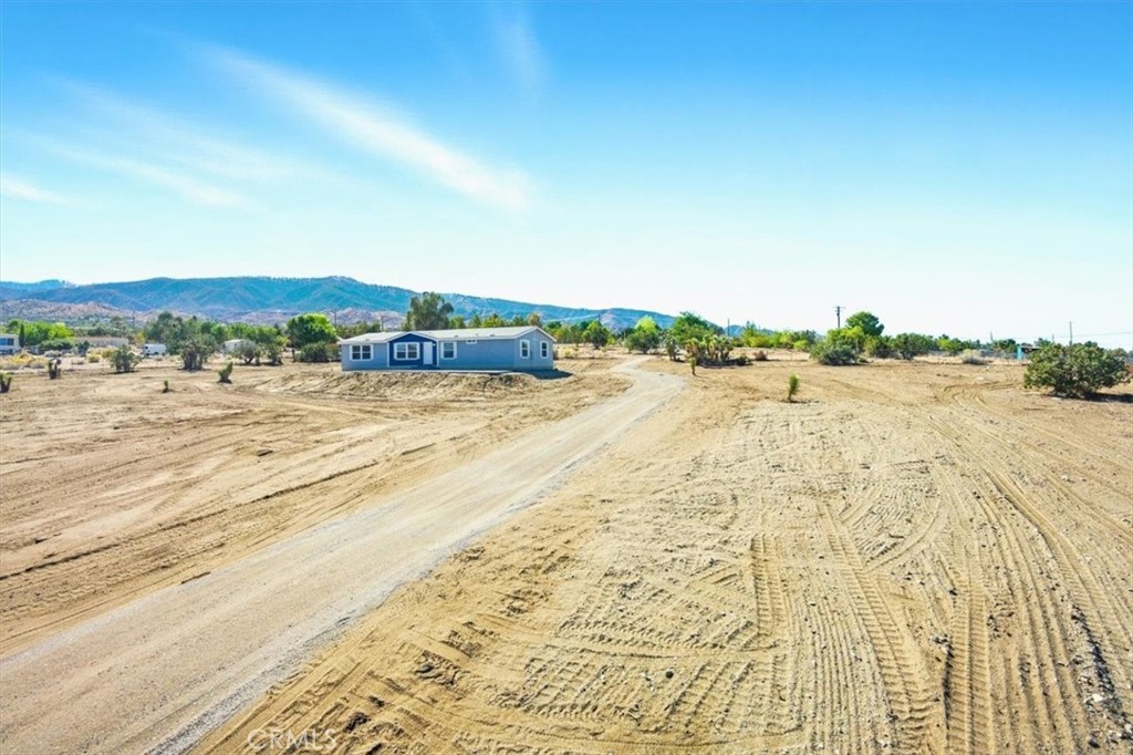 9622 Via Verde Avenue Pinon Hills, CA 92372 - Photo 4 of 48 a view of an ocean beach