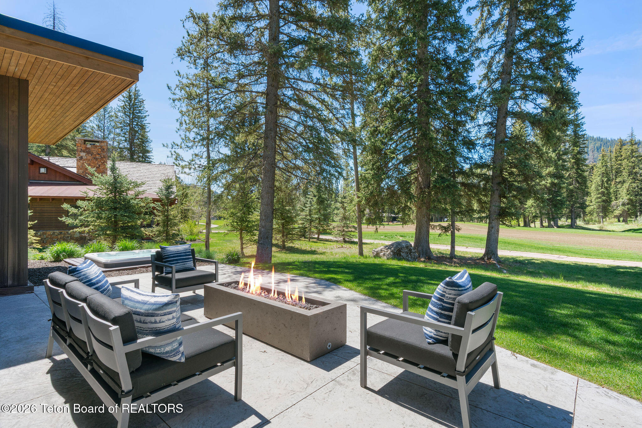15505 Tall Timber Road Jackson, WY 83001 - Photo 3 of 40 Outdoor seating with propane fire pit