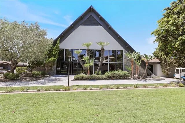 a gym room with lots of furniture and a flat screen tv