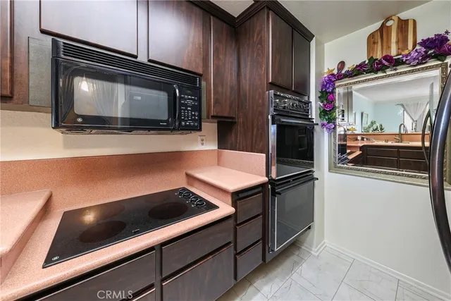 a kitchen with a stove and a microwave