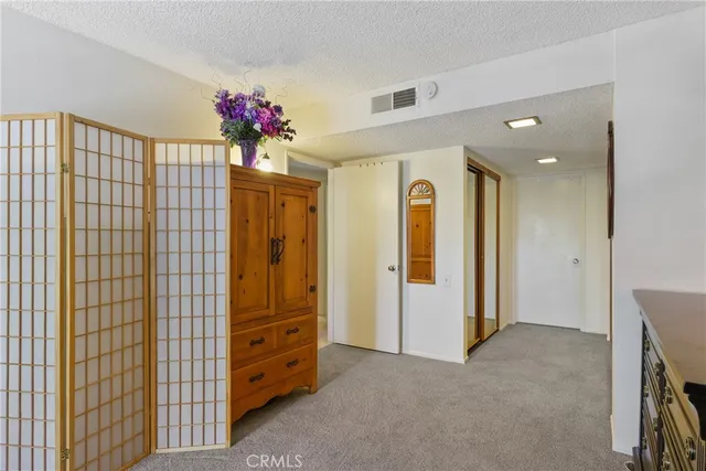 a bed room with a bed and a large window