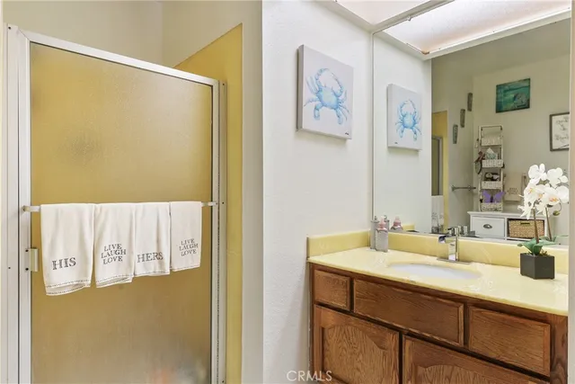 a living room with a couch and a potted plant