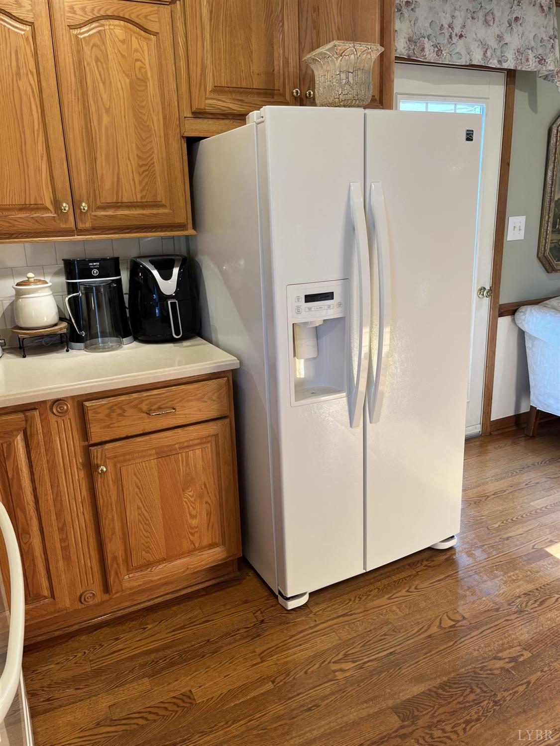 3912 Lowry Road Goode, VA 24556 - Photo 12 of 56 a white refrigerator freezer sitting in a kitchen